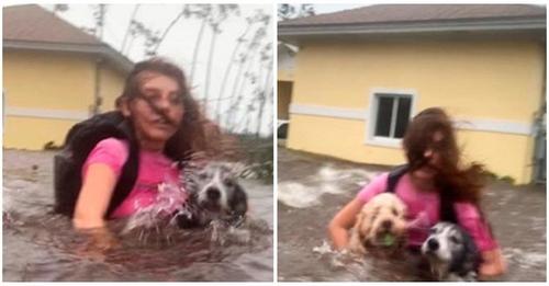 Abraza a sus perritos con todo lo que le queda de fuerzas para huir durante un huracán, nunca los abandonaría